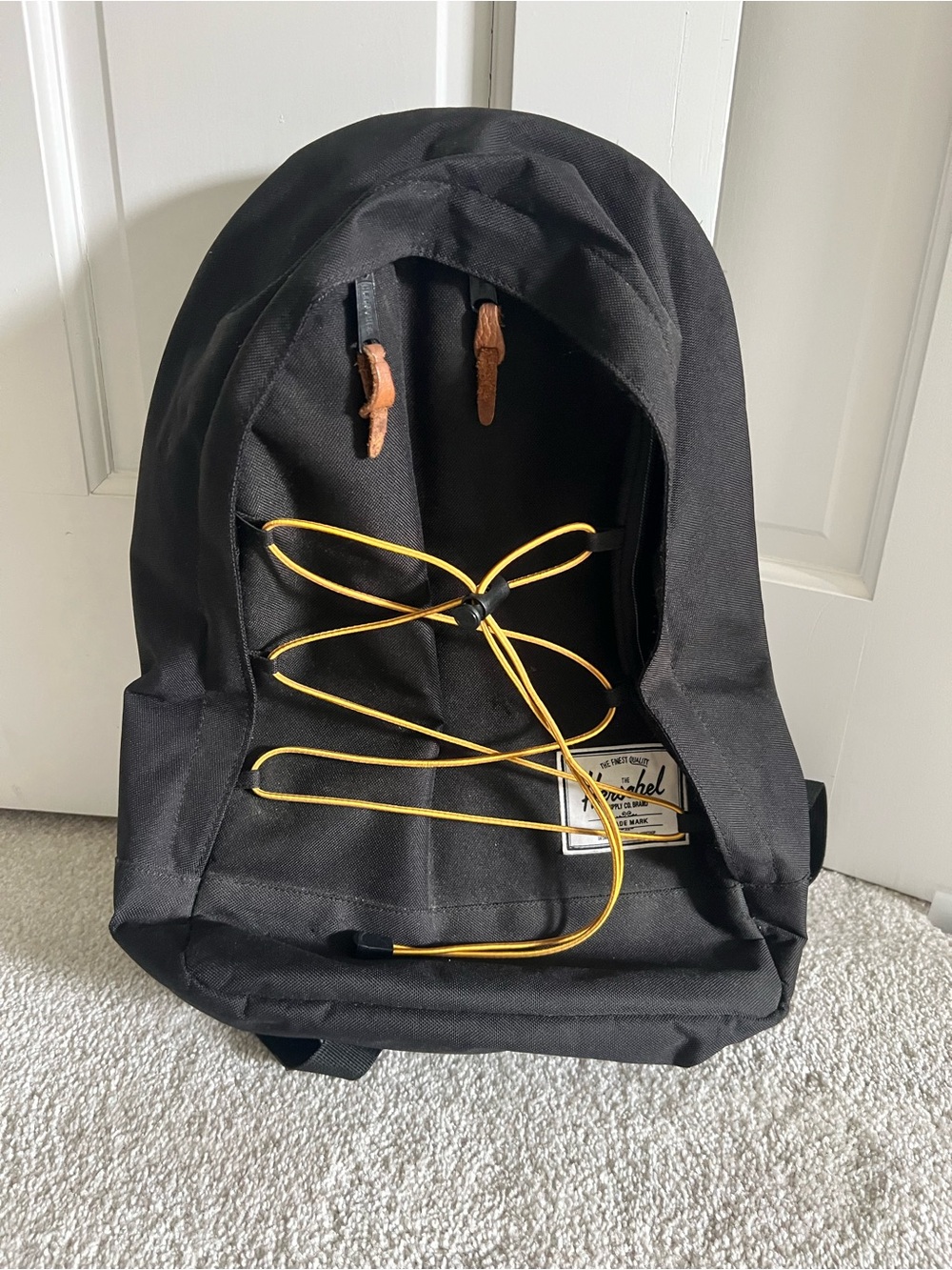 Herschel Black Backpack with Yellow Cord